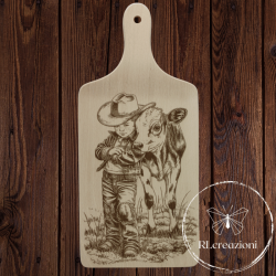 tagliere in legno di faggio inciso con il laser. Bambino con mucca. Cowboy